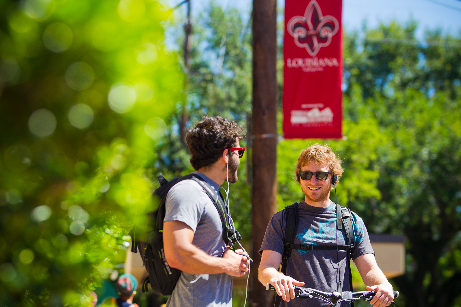 Two students on UL Lafayette's campus chatting in between classes